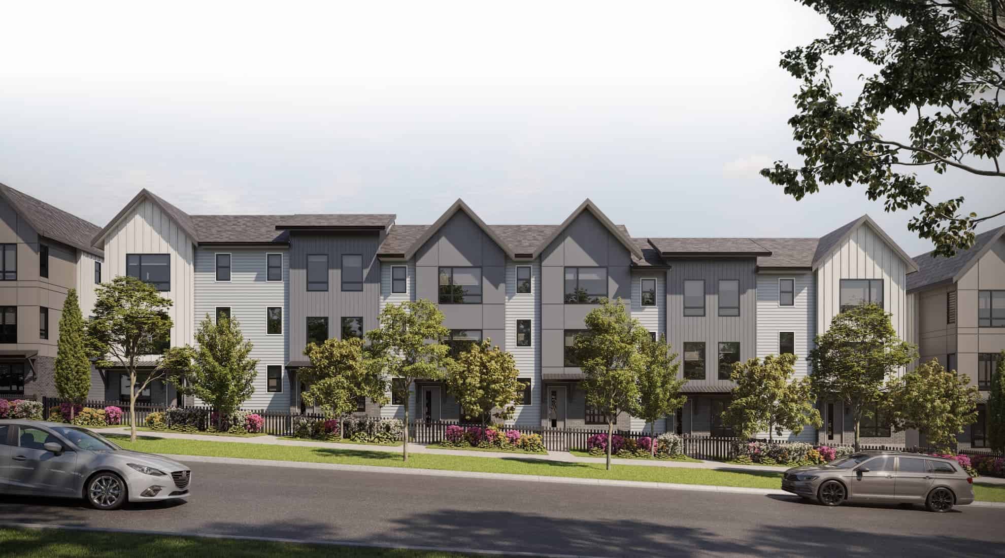 Street view of Gradience townhomes in Langley, BC, featuring modern architecture and lush landscaping by Apna Group